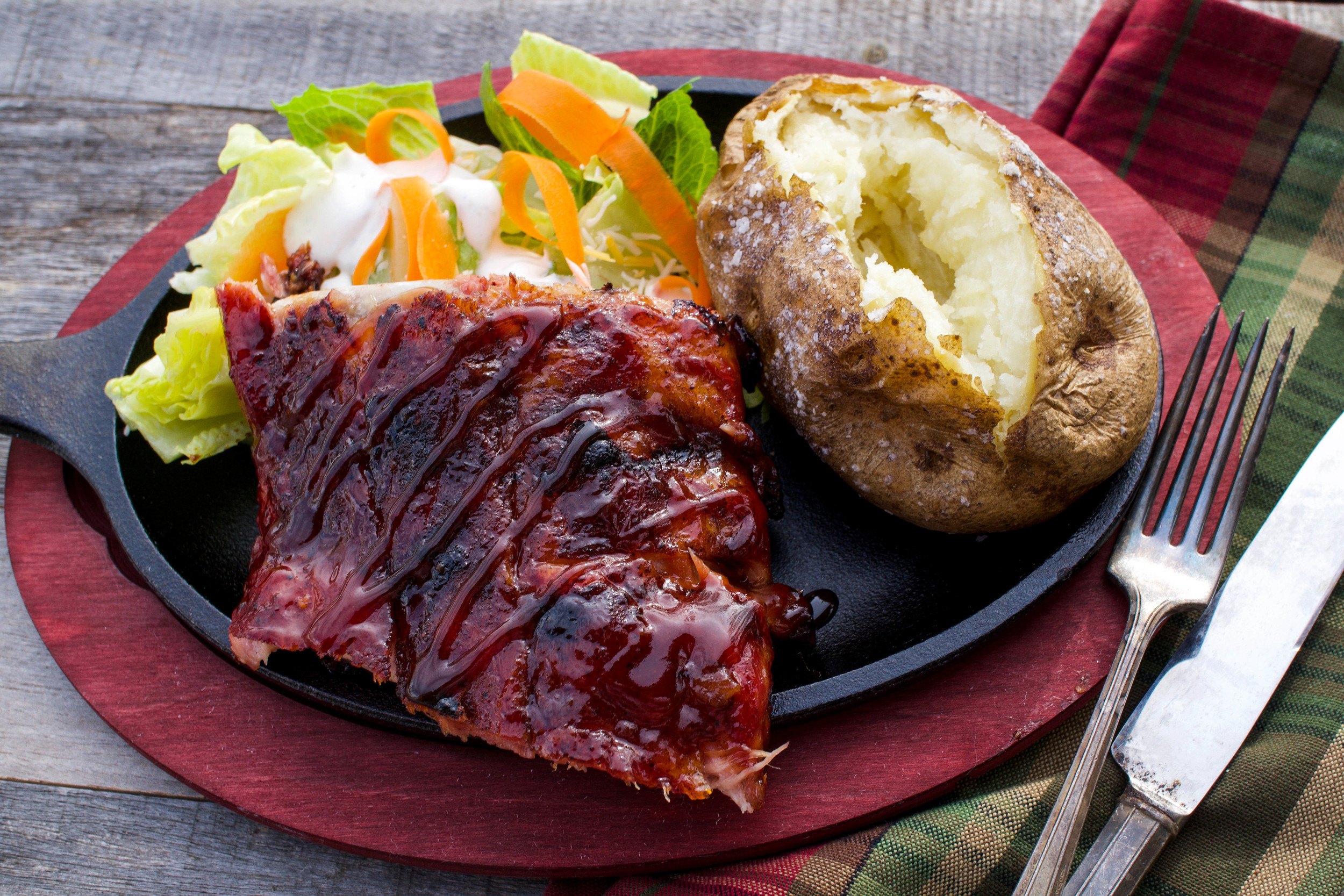 Homemade barbecue sauce with ribs